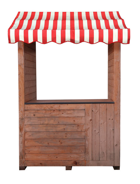    This is an empty wooden stall stand with red white awning.                             - Photo, Image