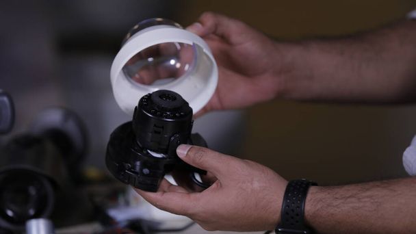 A man repairing secur camera in service center - Photo, Image