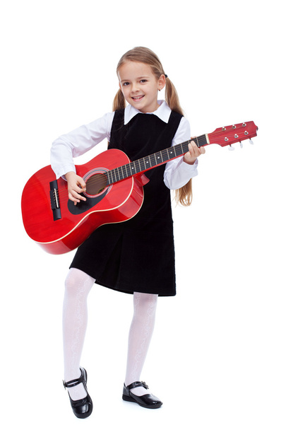 Little girl in black dress holding red guitar - Foto, Imagen