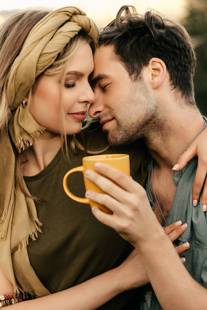 Young couple having fun drinking morning coffee together. High quality photo - Photo, Image