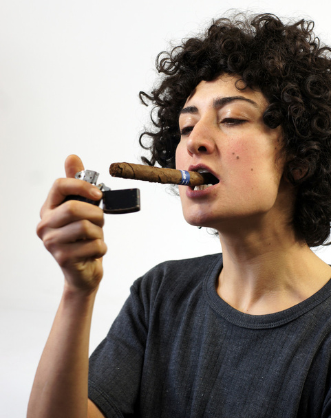 Woman lights up a cigar - Photo, Image