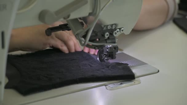 sewing faux fur to part of soft winter boot - Footage, Video