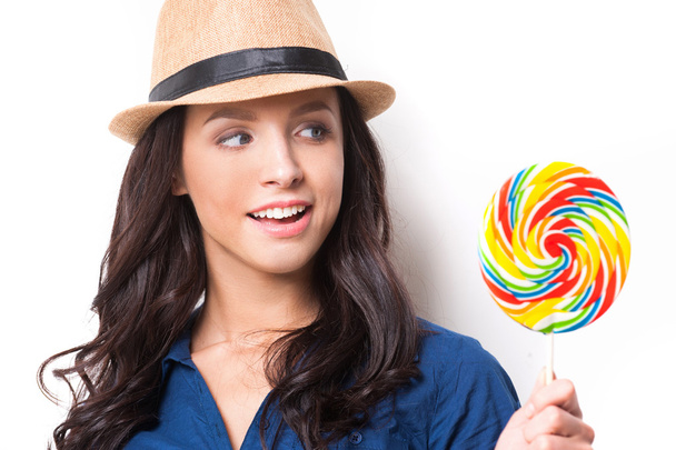 Woman looking at big lollipop - Foto, Imagem