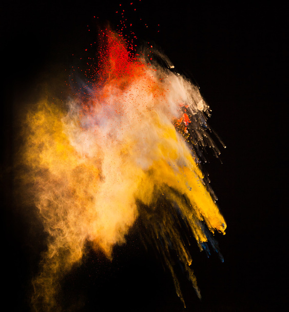 Colored powder in abstract shape isolated on black background - Photo, image