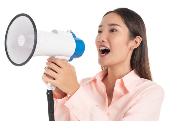 young beautiful asian girl holding a megaphone isolated against white background  - Zdjęcie, obraz