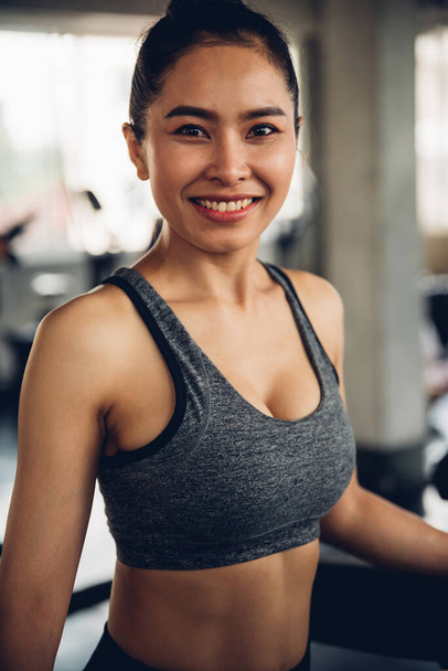 Beautiful asian woman exercising in gym - Фото, зображення