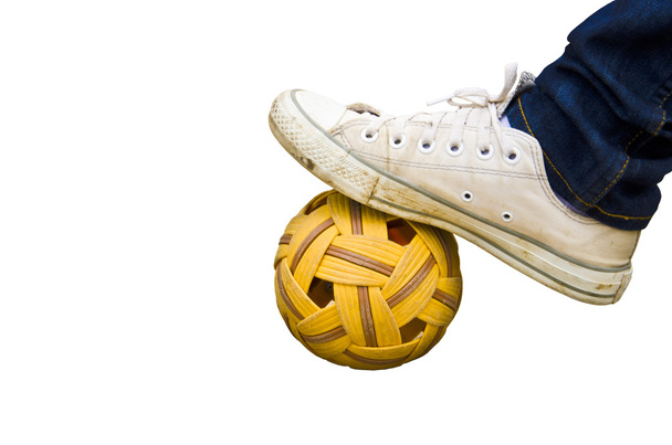 foot and old shoes on Rattan ball , asia favorite sports  - Fotó, kép
