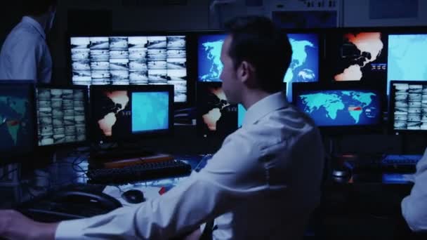 Security personnel working in system control room. - Footage, Video