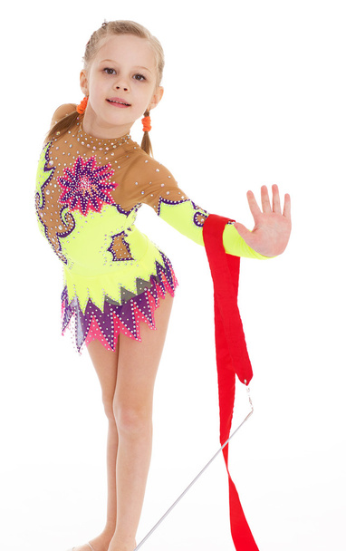 Adorable little gymnast dancing with ribbon - Fotó, kép