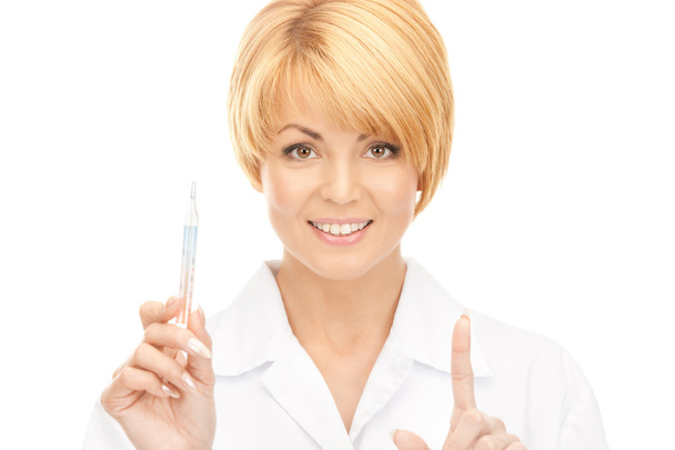 Attractive female doctor with thermometer - Foto, imagen