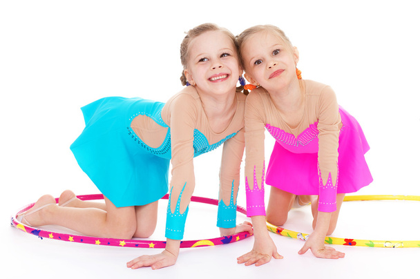 Two pretty little girl doing gymnastics - Foto, imagen