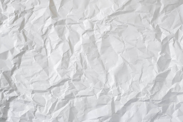 Zerknülltes weißes Papier als Hintergrund. - Foto, Bild