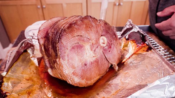 Cooking honey baked ham in a residential kitchen. - Photo, Image
