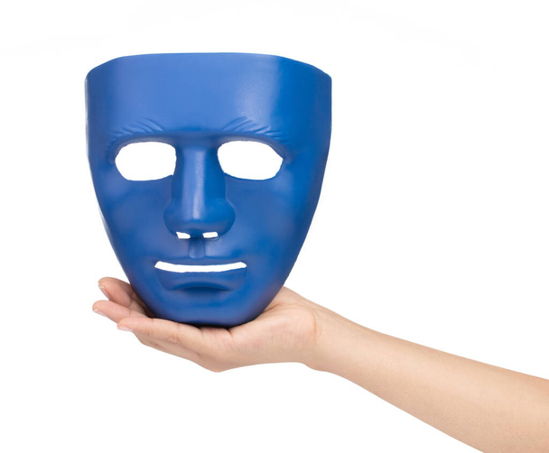 Main tenant masques bleus isolés sur fond blanc - Photo, image