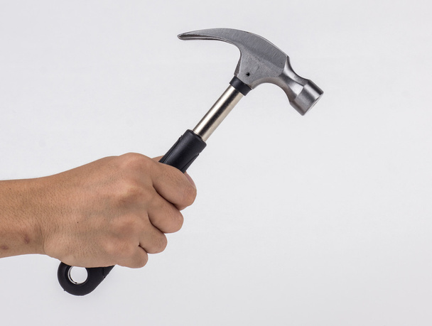 Man's hand holding hammer - Foto, Bild