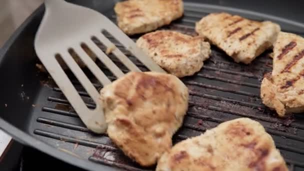chicken meat with spices on a grill pan. chicken fillet. - Footage, Video