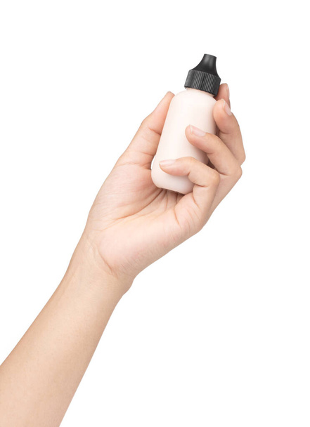 hand holding makeup liquid foundation isolated on white background - Photo, Image