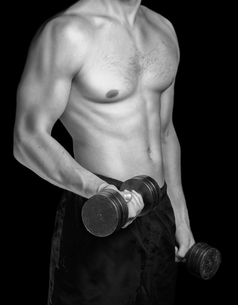 Izmos férfi súlyzókkal - Fotó, kép