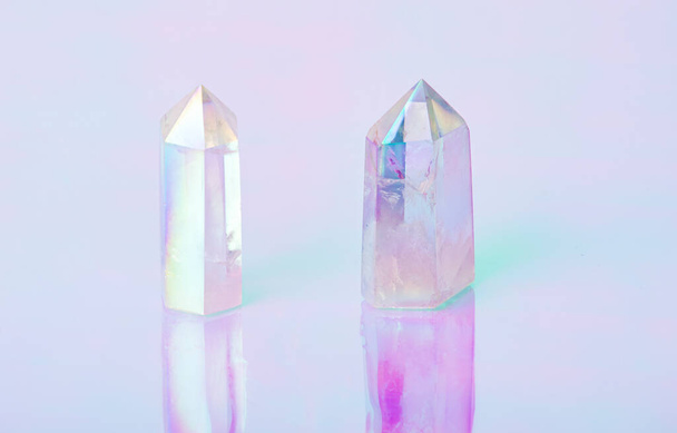 Natural clear crystal quartz electroplating rainbow on holographic background. Meditation, reiki and spiritual healing concept - Photo, Image