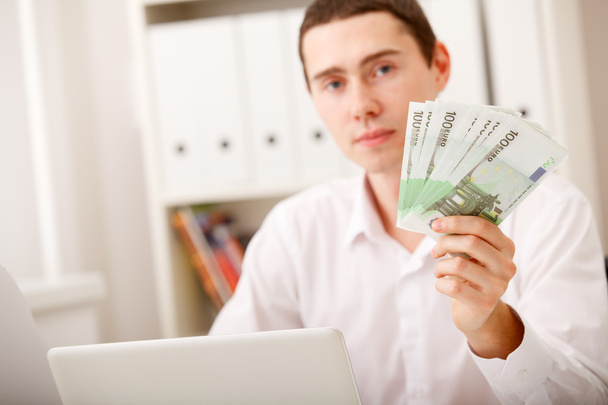 Man with Euro in office - Photo, Image
