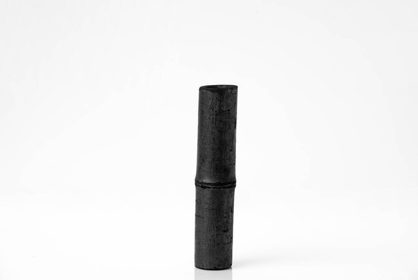 Bamboo activated charcoal stick isolated on white background.  - Photo, Image