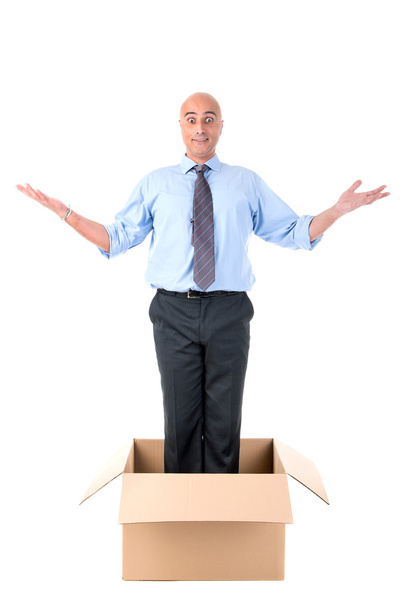 zakenman in een doos - Foto, afbeelding