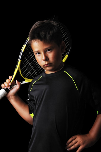 Portrait of handsome boy with tennis equipment - 写真・画像