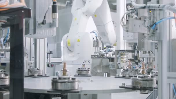 Advanced robotic machine manufacturing parts in an automated assembly line - Footage, Video
