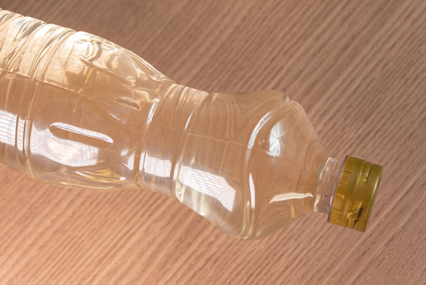 Container of vinegar on the wooden background - Photo, Image