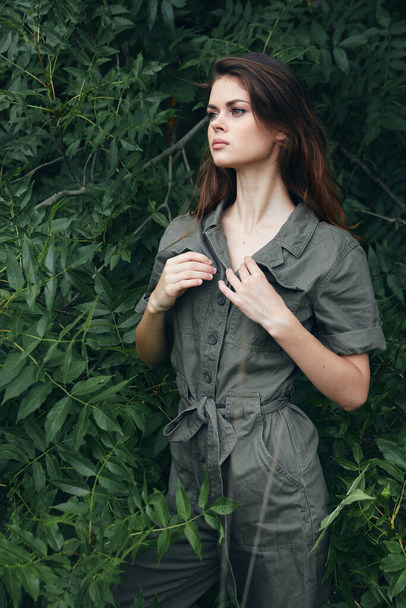 Model loneliness adventure concept gray jumpsuit against the background  - Fotografie, Obrázek