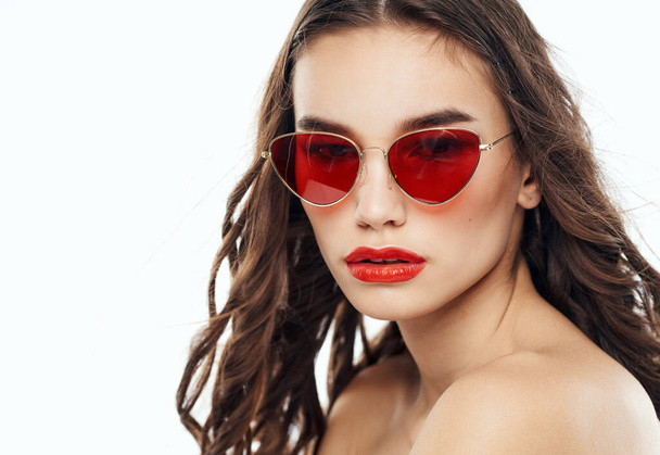 Romantic woman model in glasses on a light background close-up - Foto, Bild