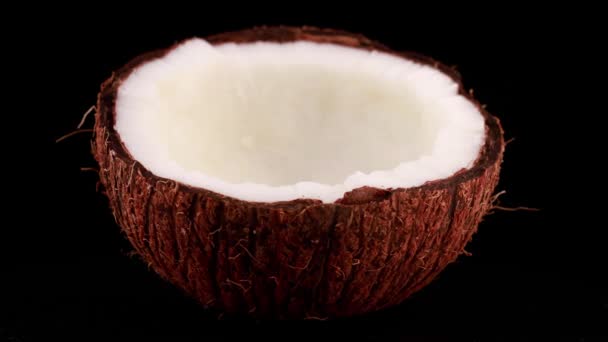 Chopped coconut on a black background - Footage, Video