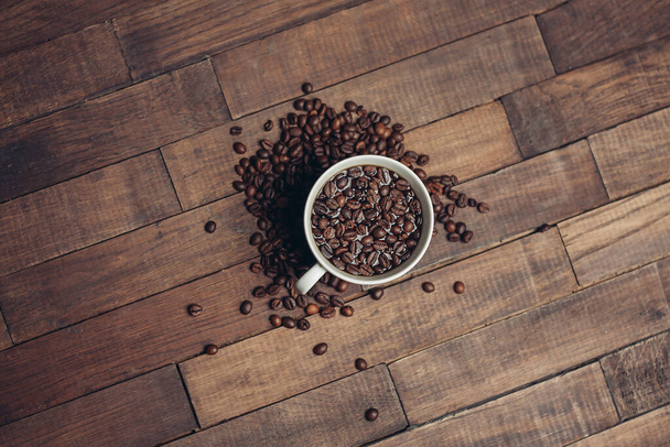 white cup with coffee beans aromatic drink morning energy - Foto, Imagen