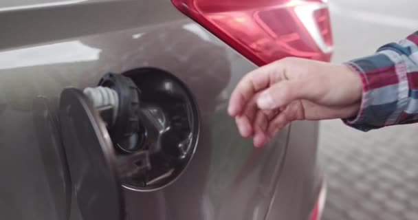 Close-up Of A Man Fueling With Diesel In A Car At A Gas Station. Full Diesel Tank, End of Refueling. The Man Pulls A Refueling Gun Out Of The Machine Tank And Closes The Tank Cover Translation: Diesel - Footage, Video