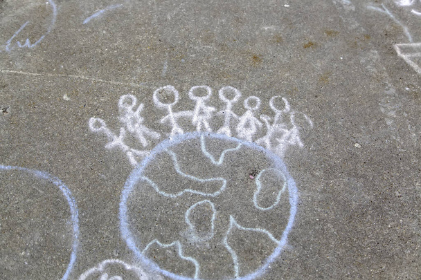 Drawing of the world on the ground made by children, equality and the environment - Photo, Image