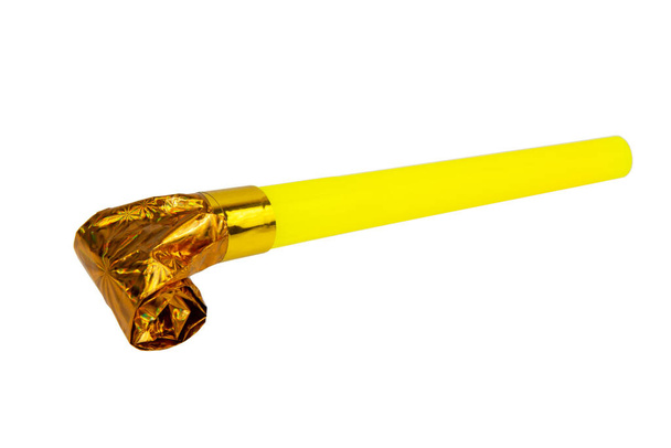 Rolled gold foil festive noisemaker or party whistle horn isolated on the white background - Fotó, kép