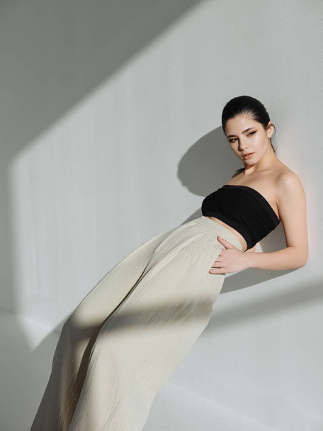 luxury woman fashion clothes leaning on the wall fashion - Valokuva, kuva