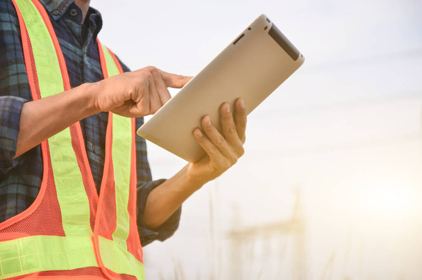 Electrician are using tablets at work sites. - Photo, Image