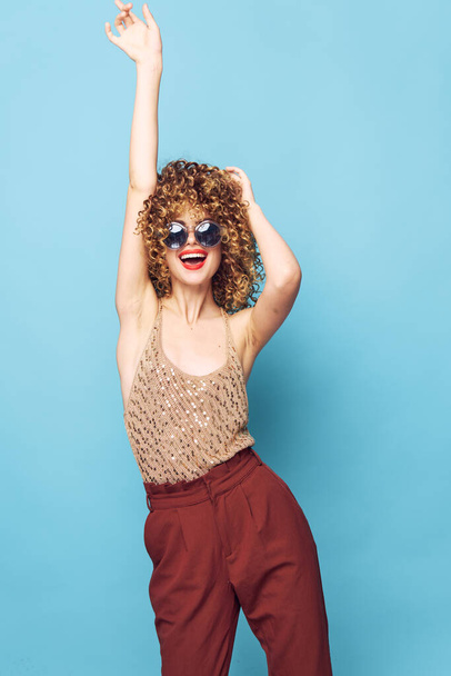 Model Curly hair hung disco fashion clothes studio brown pants  - 写真・画像