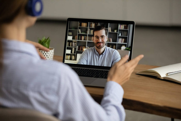 Woman speak on video call with male colleague - Foto, Bild