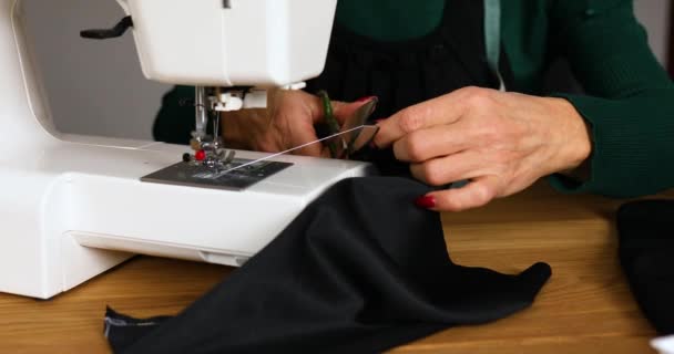 Step by step, 50-yers old woman sews clothes on sewing machine - Footage, Video