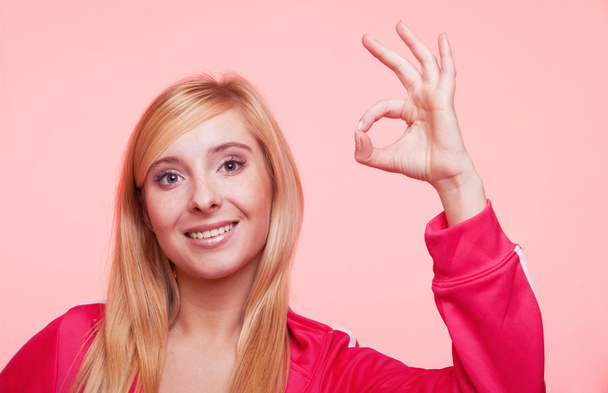 sporty fit woman showing ok sign hand gesture - Zdjęcie, obraz