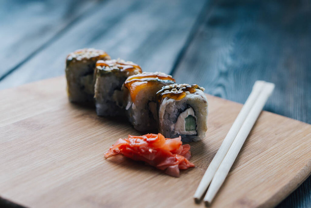 sushi chopsticks wood board sauce menu restaurant - Φωτογραφία, εικόνα