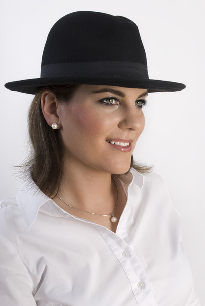 Portrait of young attractive elegant woman in black hat. Not isolated. - Fotografie, Obrázek