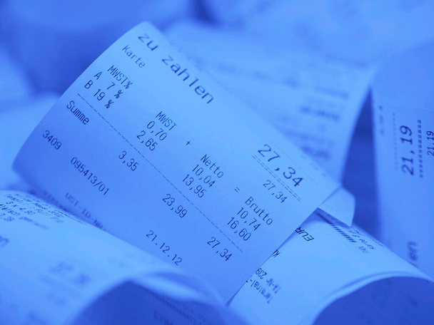 Blue receipts with the imprint "zu zahlen", translation "to pay" - Photo, Image
