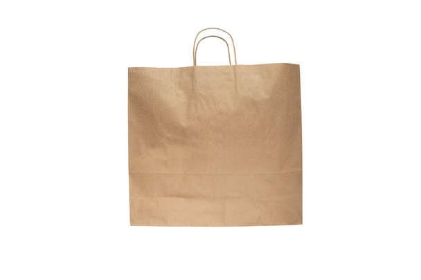Shopping kraft paper bag with handles isolated on white.  - Photo, Image