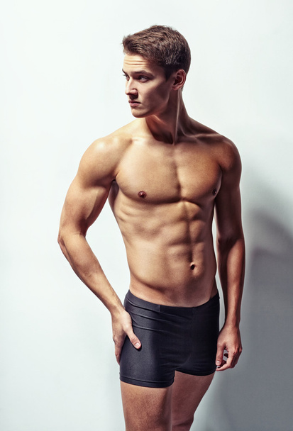 Portrait of a young sexy muscular man - Fotó, kép