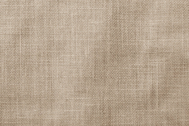 Patrón de textura tejida de tela de saco de Hesse fondo en tono de color marrón crema claro tierra beige - Foto, imagen