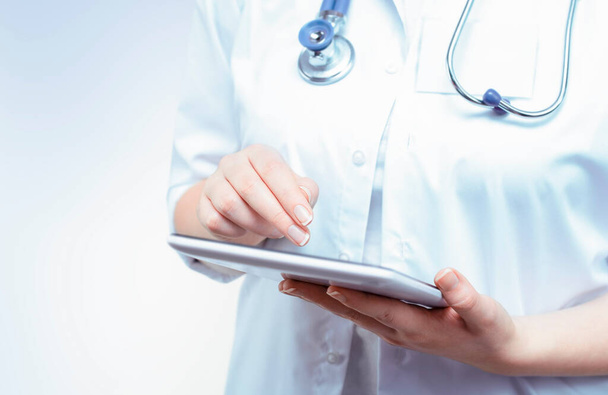 female doctor working on digital tablet - Photo, Image