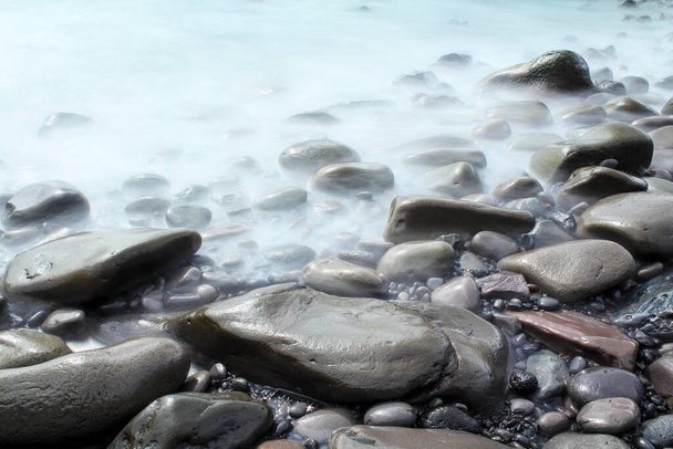 Time exposure of stones at the beach of Hellnar, Snaeffelsnes National Park - Photo, Image